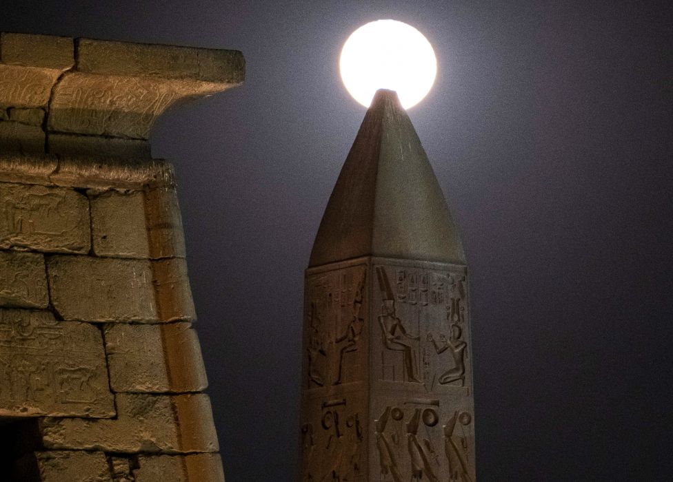 The moon rises in Luxor, Egypt - Wednesday 19 January 2022