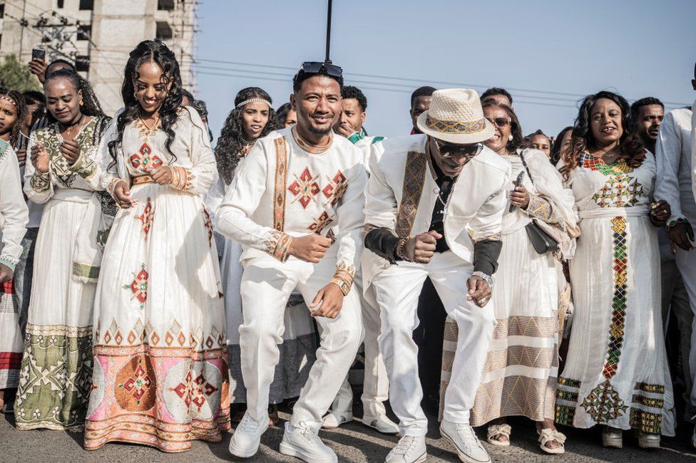 Couples dressed in a traditional attire dance during a mass wedding called 'Yeshih Gabicha' in Addis Ababa, Ethiopia.