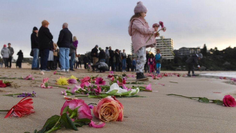 Friends held a vigil at Sydney's Freshwater beach on Wednesday morning