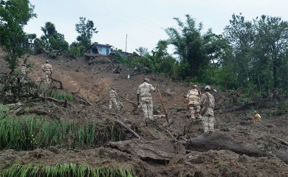 This handout photograph released on July 2, 2016 by the Indian Army shows Indian soldiers searching for survivors of a landslide following torrential rains in the Pithoragarh area of rural Uttarakhand state.