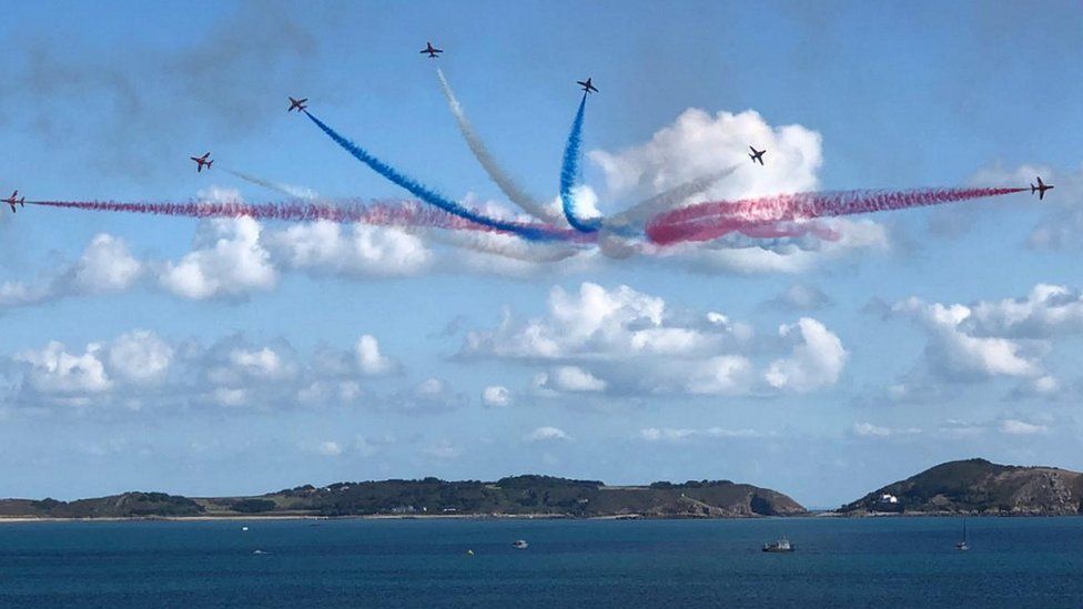 Red Arrows with Herm in the background