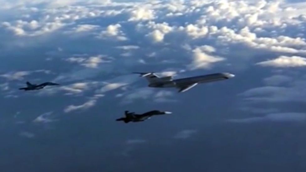 An archive picture of a Russian Tu-154 plane escorted by Russian Su-34 bombers