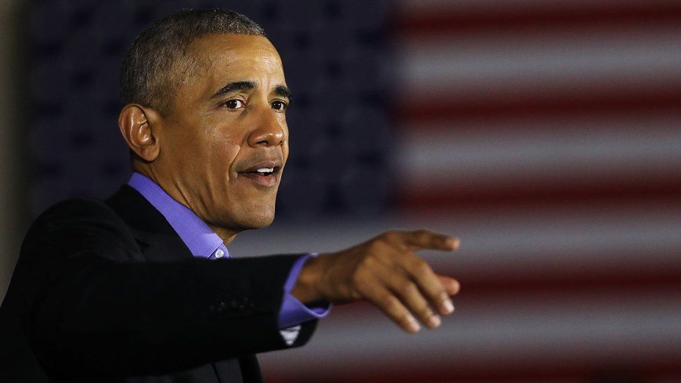 Former US President Barack Obama speaks during a campaign rally in Newark, New Jersey on 19 October