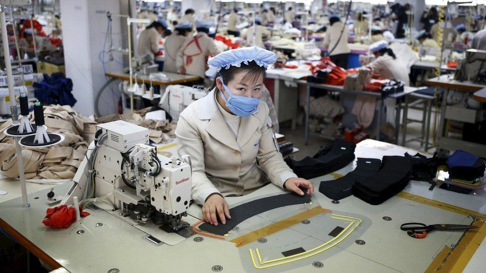 A North Korean employee works in a factory of a South Korean company at the Joint Industrial Park in Kaesong industrial zone, a few miles inside North Korea from the heavily fortified border in this 19 December 2013 file photo.