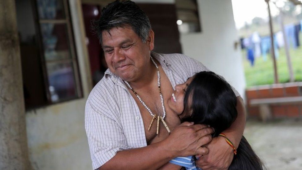 Lazaro Kamlem, 47, cacique of Palmeira village, hugs his daughter Ludmila, 10, at their house in Xokleng Laklano indigenous land, Jose Boiteux, Santa Catarina state, Brazil, August 19, 2021.