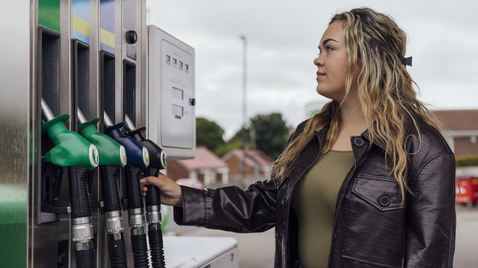 Woman at petrol station