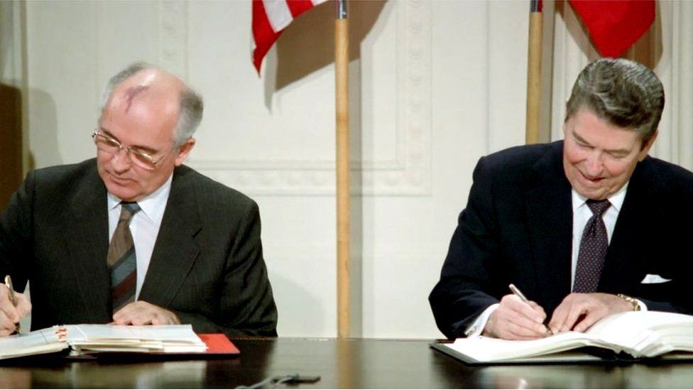 Mikhail Gorbachev and Ronald Reagan signing the INF treaty in 1987