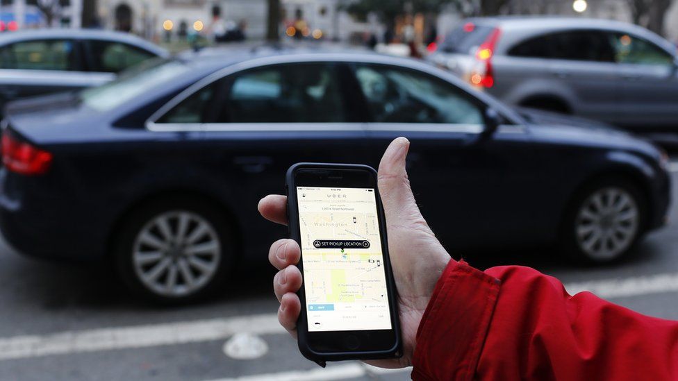 Uber app in hand