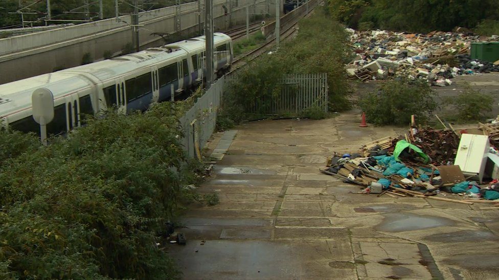 The onlookers raised concerns about the rubbish getting blown onto the train tracks