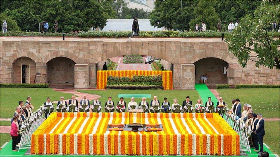 India's Prime Minister Narendra Modi (C) along with world leaders pays respect at the Mahatma Gandhi memorial at Raj Ghat on the sidelines of the G20 summit in New Delhi on September 10, 2023.