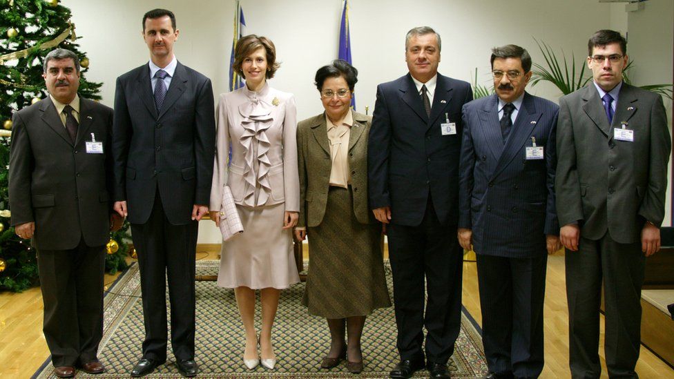 Khaled al-Ayoubi (far right) pictured with President Bashar al-Assad (second left)