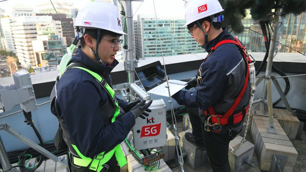 Engineers check a 5G mast in Seoul, South Korea, where the technology has been available for 18 months