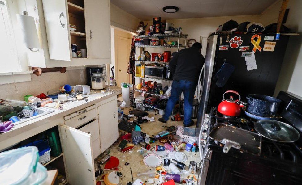 A mess on the floor of a home after the quake hit