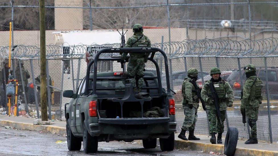 Members of the Mexican Army reinforce security near a prison the day after a riot left 17 dead, in Ciudad Juarez, Mexico 02 January 2023. Inmates also escaped during the riot.