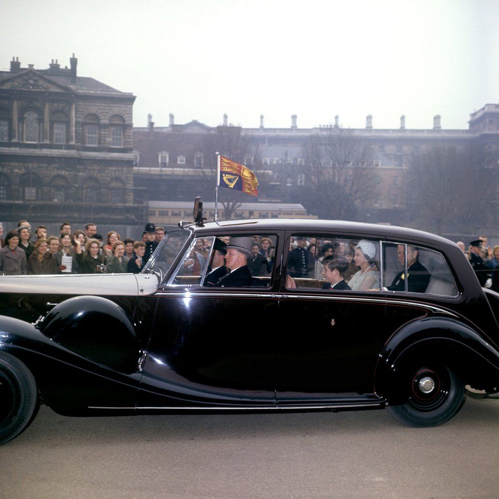 Queen Elizabeth II, the Duke of Edinburgh and Prince Charles, driving to Westminster Abbey for the wedding of Princess Alexandra and Angus Ogilvy