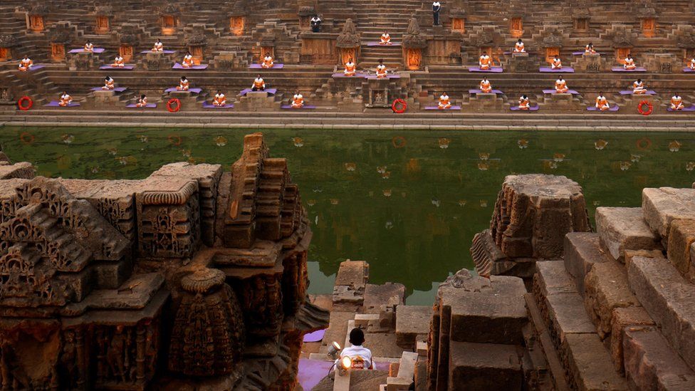 Participants meditate to welcome the new year at the Sun Temple in Modhera village near Ahmedabad, India
