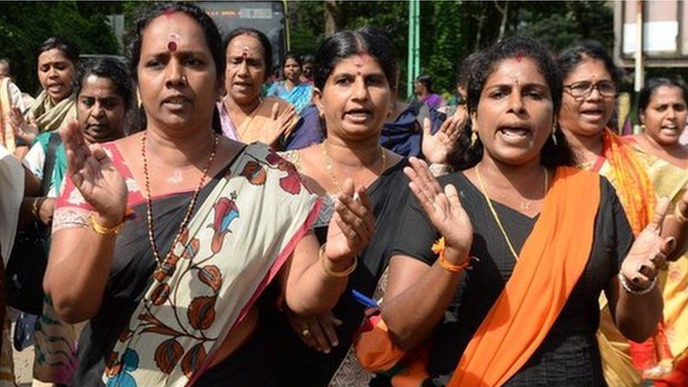 Hindu women devotees and activists shout slogans praising the Hindu God Ayyapa during a protest against the Supreme Court verdict revoking a ban on women's entry to the Sabarimala temple.