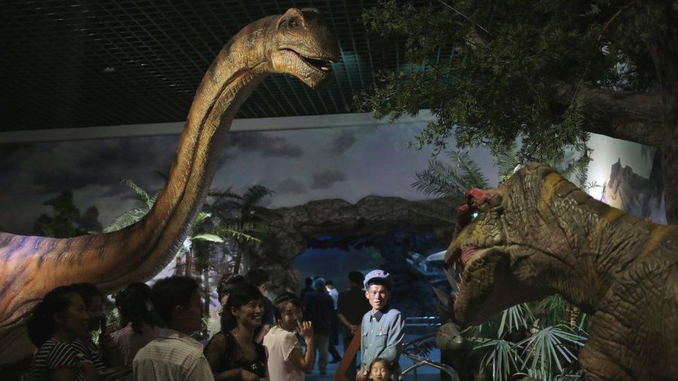 North Koreans look at models of dinosaurs at the Natural History Museum, part of the newly opened Pyongyang Central Zoo in Pyongyang, North Korea, Tuesday, Aug. 23, 2016.
