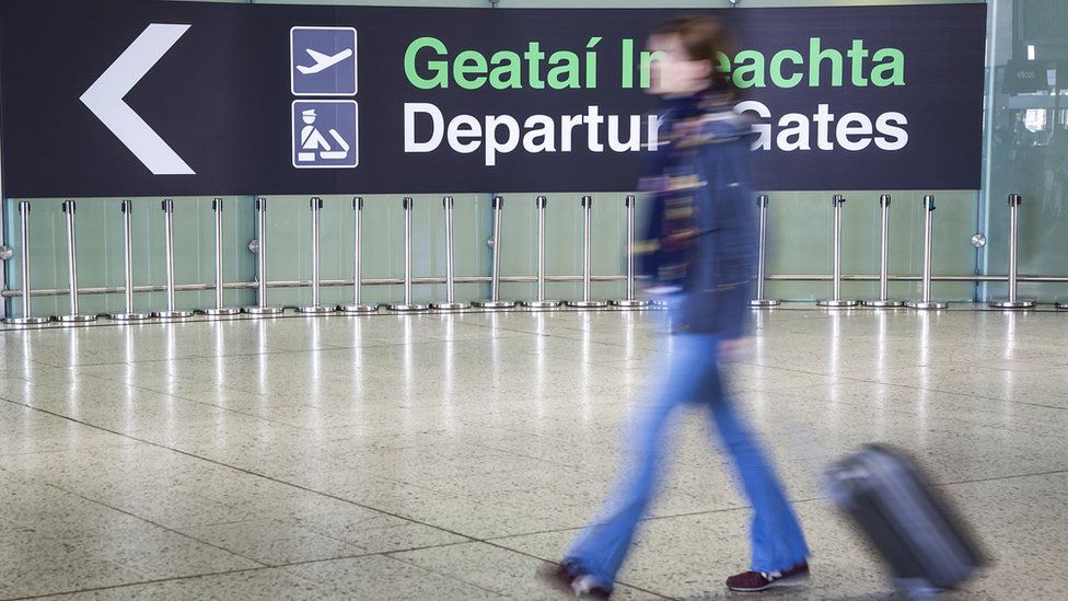 A traveller walks toward the departure gate at Dublin Airport