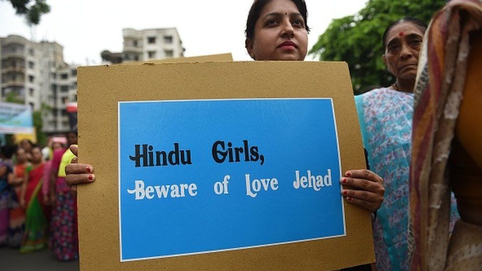 An Indian Hindu holds a placard as she takes part in a rally against 'Love Jihad', in Ahmedabad on July 22, 2018.