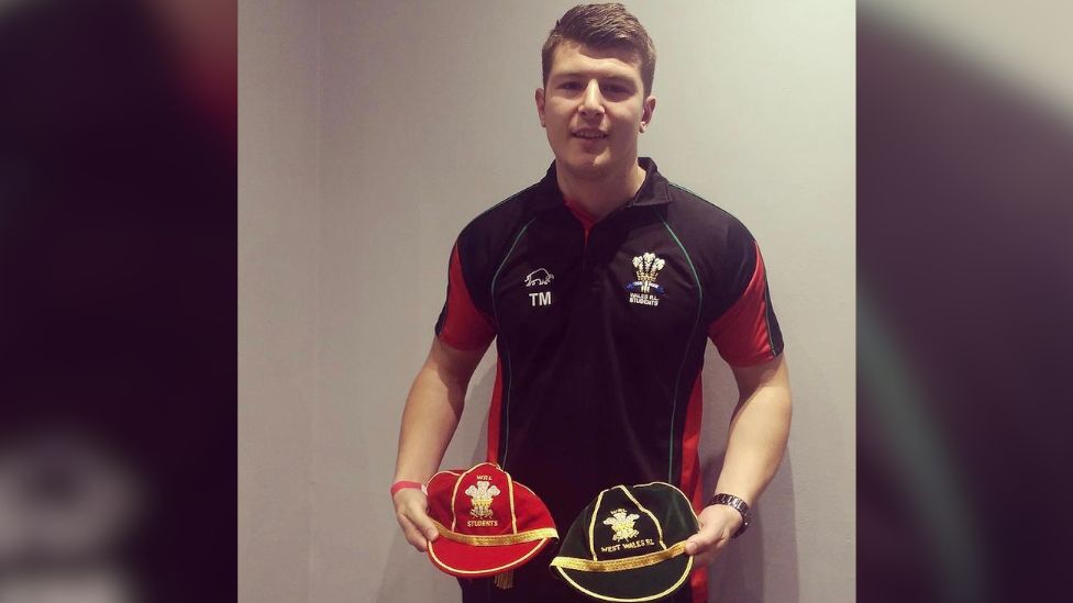 Tom Morgan with two of his Welsh caps