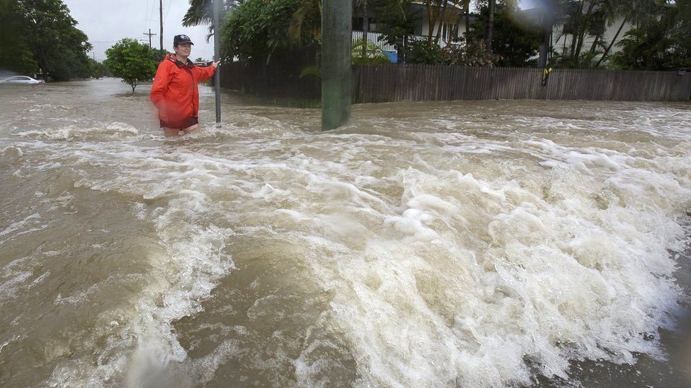 Amelia Rankin in flooded waters in Hermit Park, Townsville