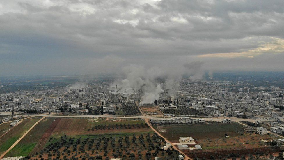 Aerial photo showing smoke rising from the Syrian town of Sarmin on 4 February 2020