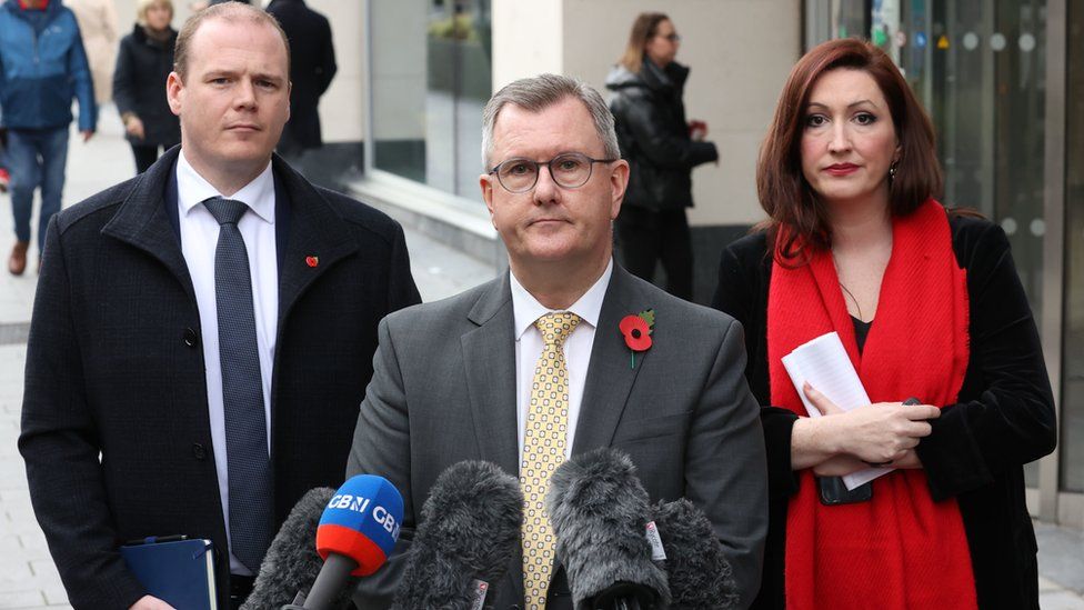Emma Little-Pengelly, Sir Jeffrey Donaldson (centre), leader of the DUP, and Gordon Lyons speaking to the media following the DUP meeting with Northern Ireland Secretary Chris Heaton-Harris at Erskine House, Belfast.