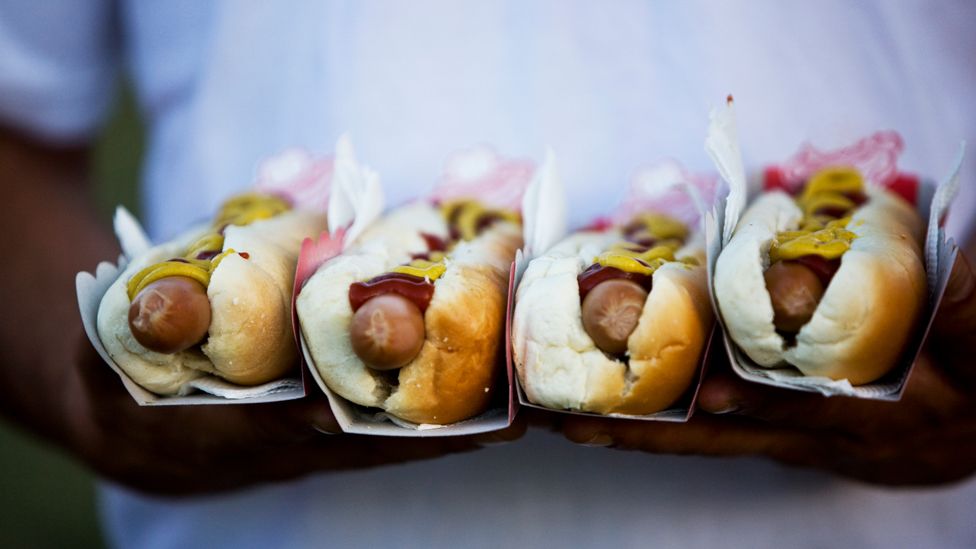 Hot dogs with mustard and ketchup,