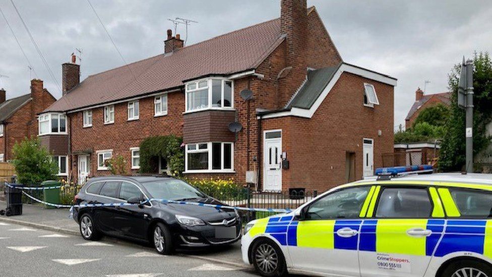 The house and a police car