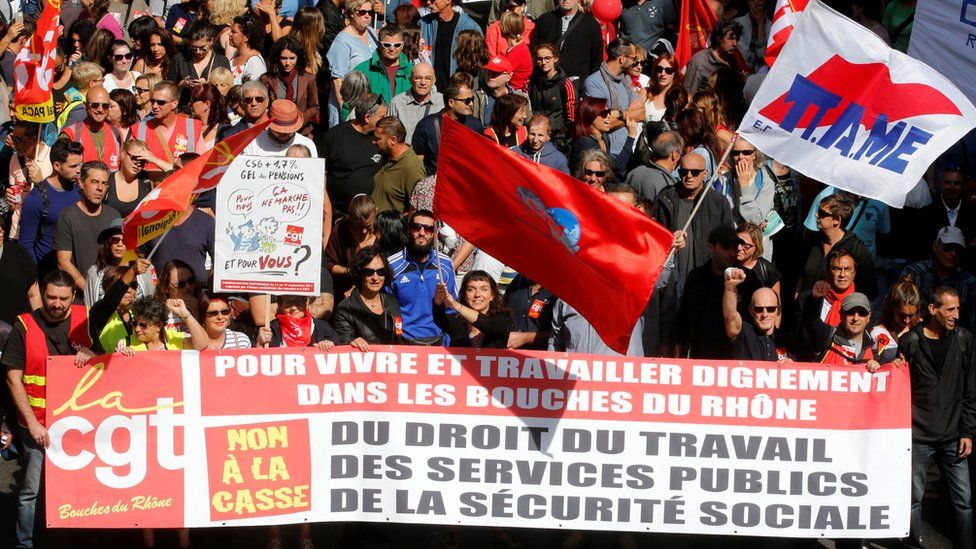 Demonstrators, holding CGT labour union flags, attend a national strike and protest against the governments labour reforms in Marseille on 12 September