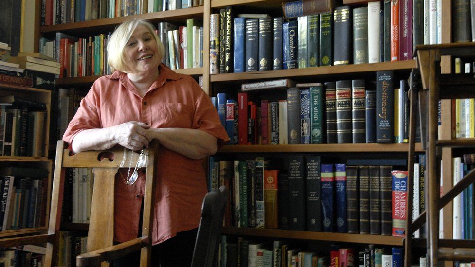 Fay Weldon photographed in her library