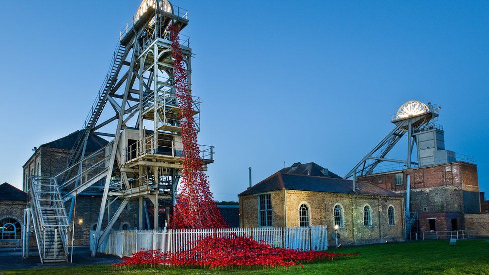 The Weeping Window ceramic poppies cascading from a pit wheel at Woodhorn Museum