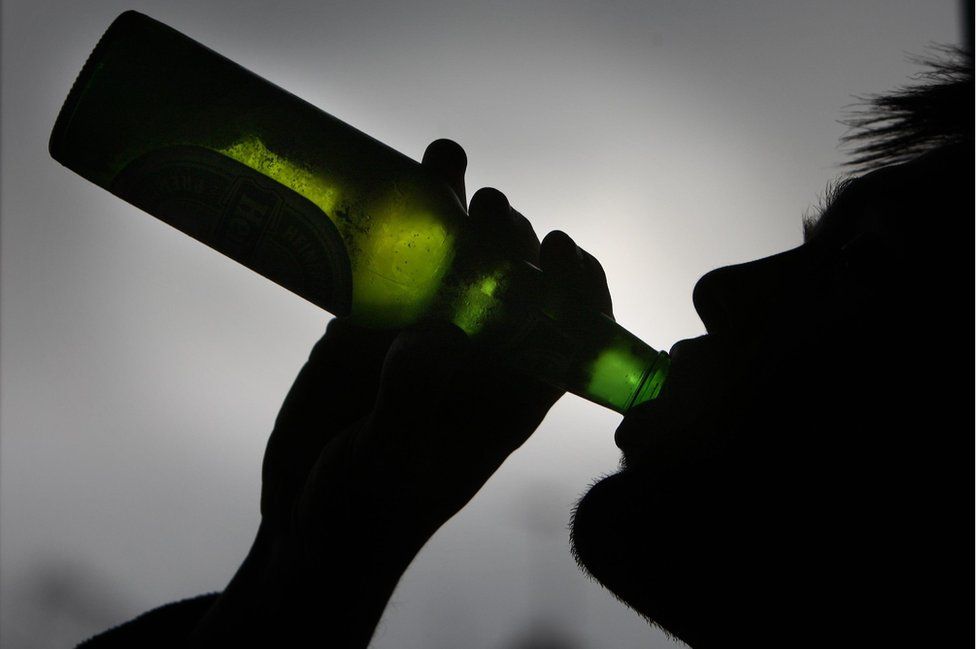 Man drinking a beer