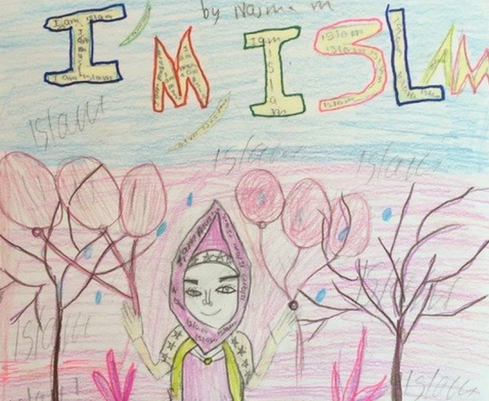 An artwork produced by one of the children of Cedar-Riverside neighbourhood, saying "I am Islam" and showing the photo of the girl in a hijab, holding balloons