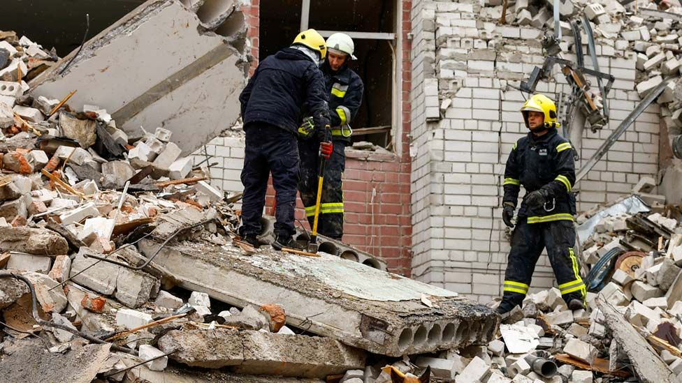Rescuers workers at the site of a destroyed building during a Russian missile strike, amid Russia's attacks on Ukraine, in Chernihiv, Ukraine on 17 April 2024