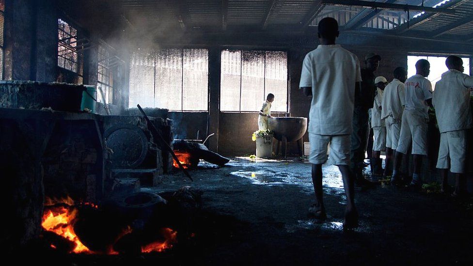 Inmates at Chikurubi Prison in the kitchen during a parliamentary committee visit in 2015