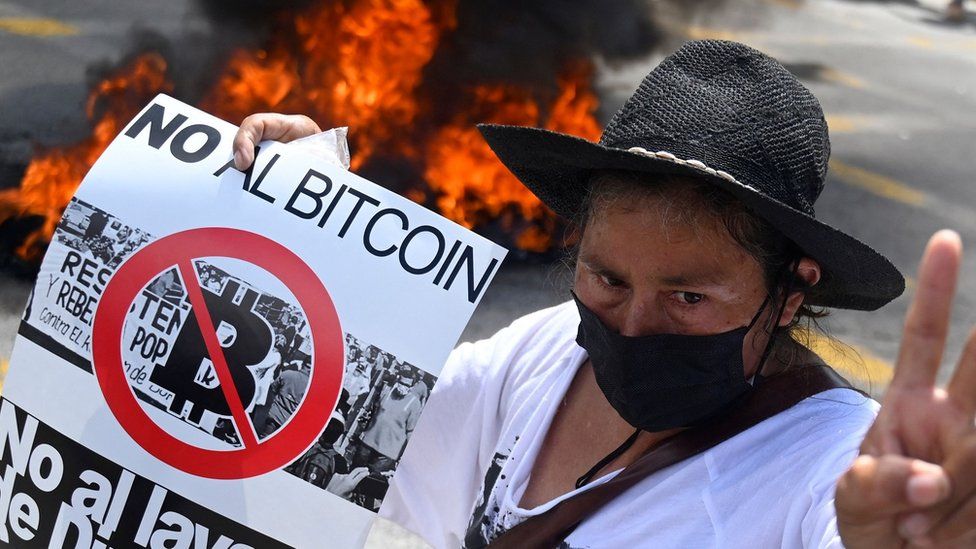 Protester with "no to Bitcoin" sign