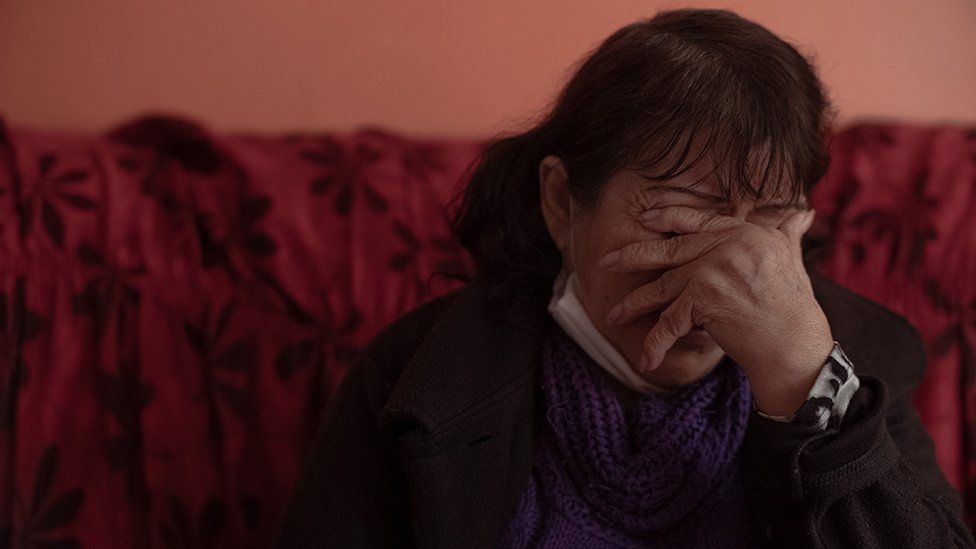 Teresa Salas Carrasco (67) in her home's living room, remembers the disappearance of her youngest daughter Alison Fernandez (30), who on the morning of August 13 went out to the local market and did not return home.