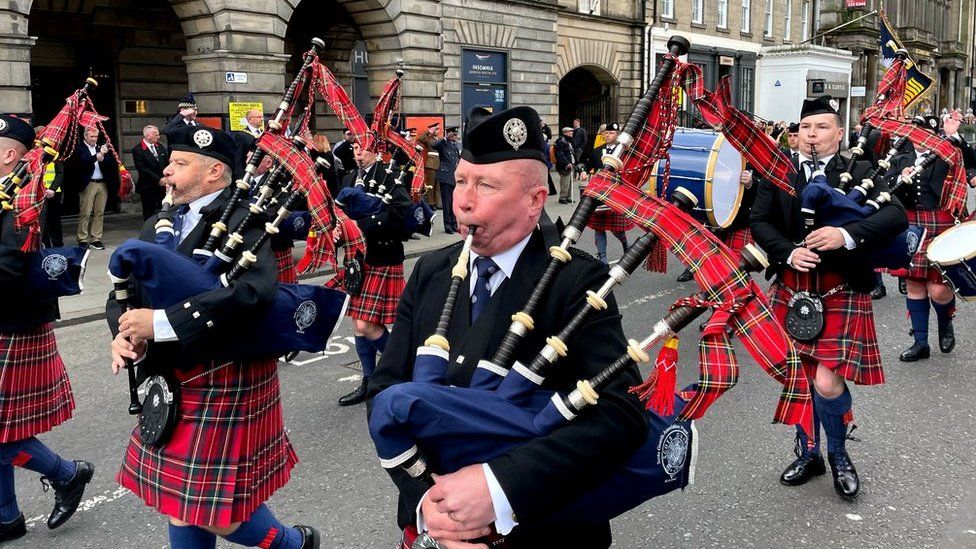 The Band of Her Majesty's Royal Marines and the Scots Guards Association Pipes and Drums led the procession
