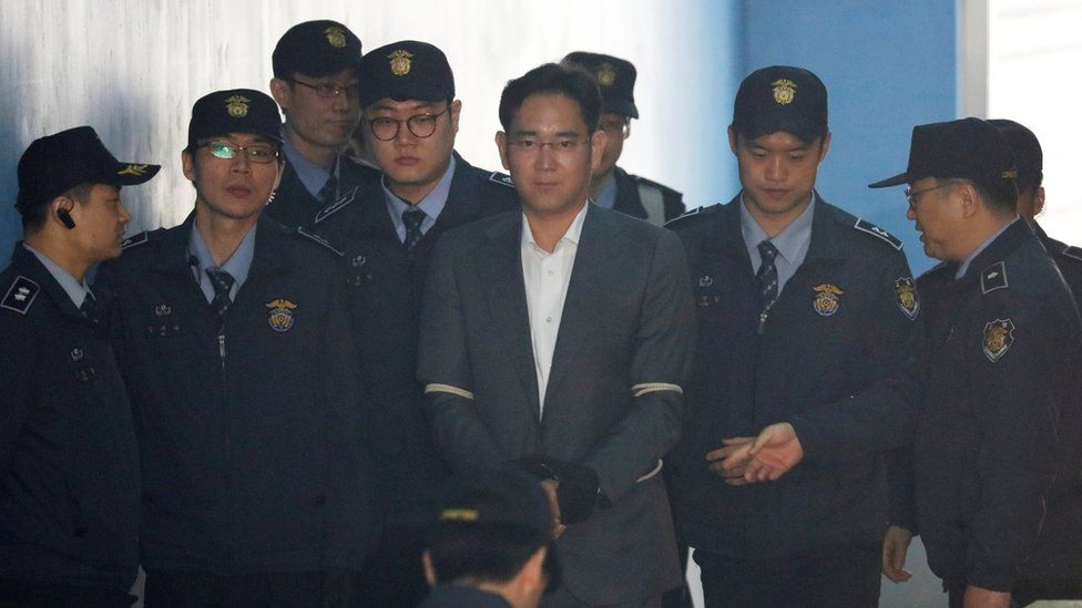 Mr Lee arrives at court in Seoul, South Korea, flanked by police officers and wearing handcuffs. April 7, 2017.