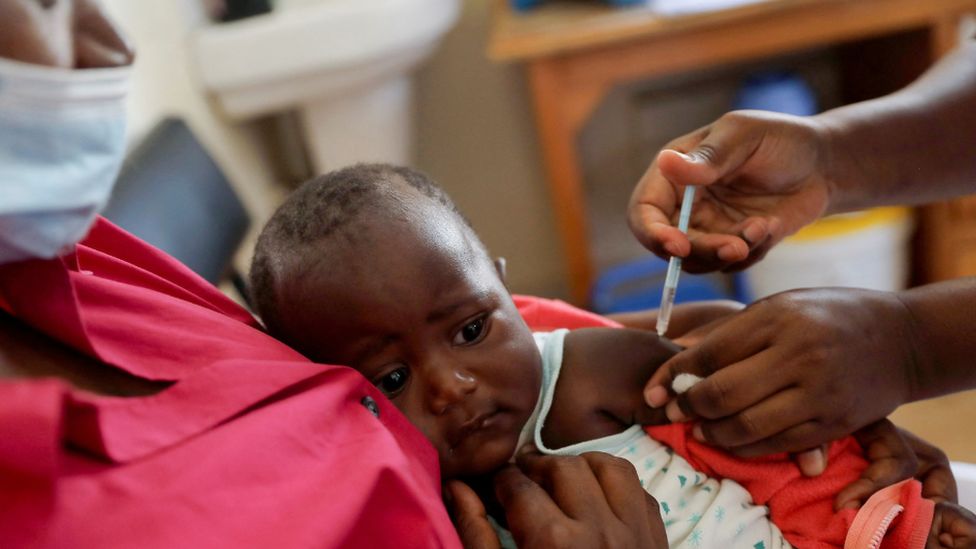 A nurse administers the malaria vaccine to an infant at the Lumumba Sub-County hospital in Kisumu, Kenya, July 1, 2022.