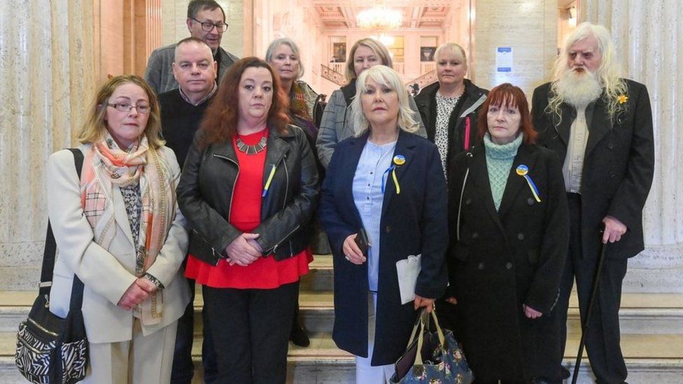 Margaret McGuckin from the group SAVIA pictured with survivors of abuse who went to Stormont on Friday