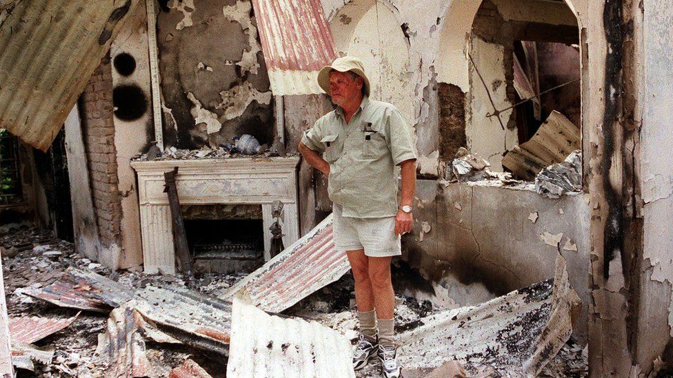 Dup Muller, 59, a commercial farmer in Headlands, 110 kilometres, (70 miles) East of Harare, shows his 17th. century clock, 11 August 2002, that was destroyed when his farm house was burnt by suspected war veterans