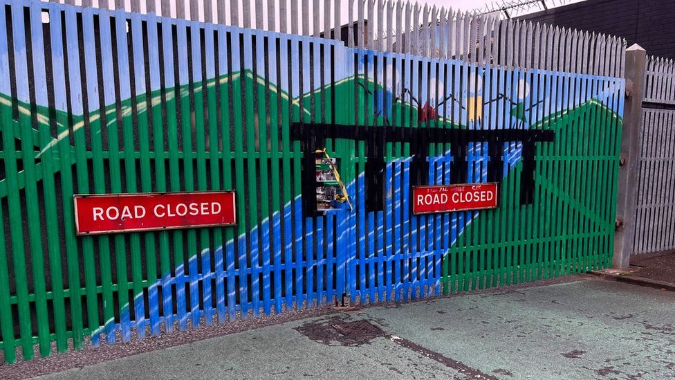 The gate at Northumberland Street in west Belfast currently opens to 19:30