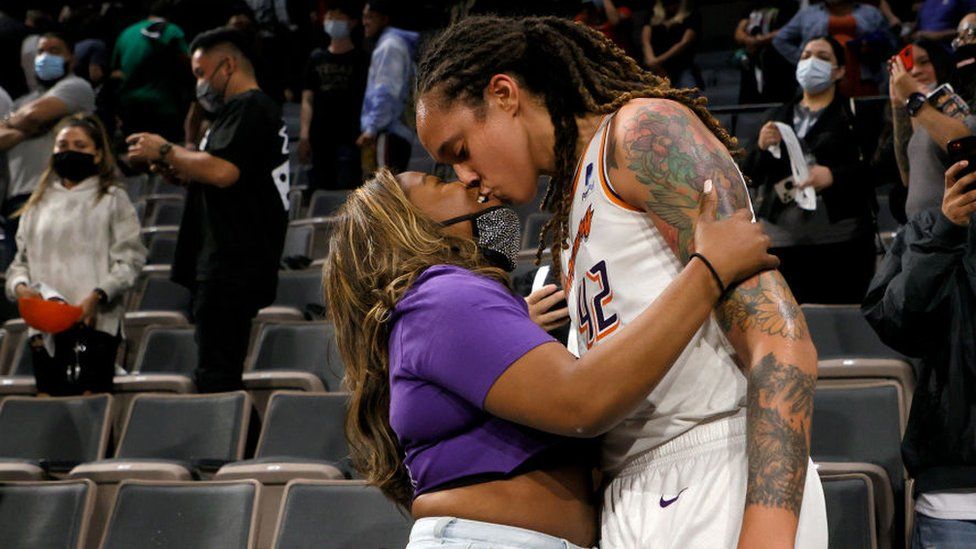 Brittney Griner #42 of the Phoenix Mercury kisses her wife Cherelle Griner in the stands after the Mercury defeated the Las Vegas Aces