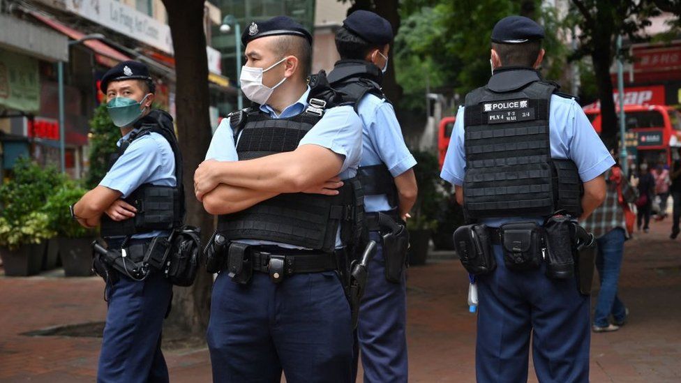 File photo of police officers standing guard in the Causeway Bay district of Hong Kong