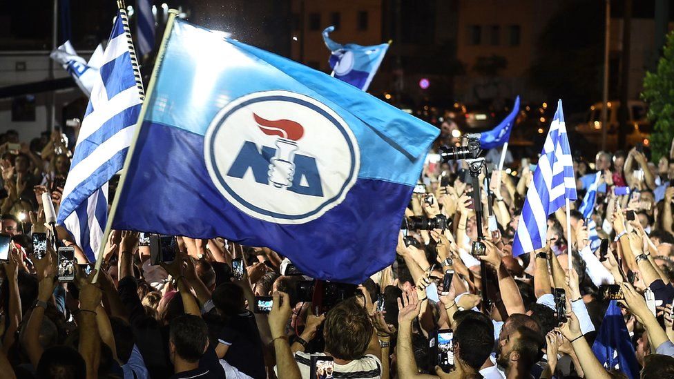 Supporters of the Greece's new Prime Minister Kyriakos Mitsotakis celebrate outside the party's headquarters in Athens, 7 July 2019