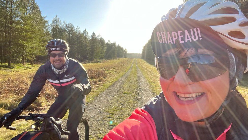 Chris Bower and Sharon Calton cycling along Wolf Way