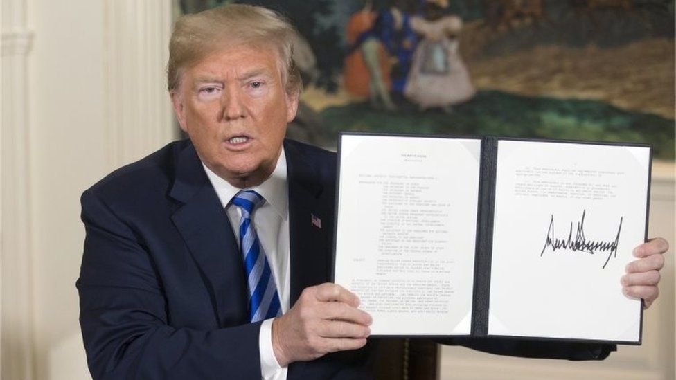 Donald Trump holds up presidential memorandum pulling the US out of the Iran nuclear deal (08/05/21)
